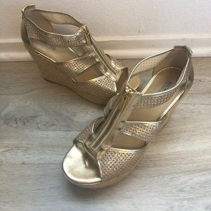 Michael Kors gold platform wedge sandal.